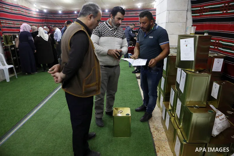 Palestinians participate in an exhibition of olive products and olive oil in the old city of Hebron, in the West Bank on November 10, 2021. Photo by Mamoun Wazwaz