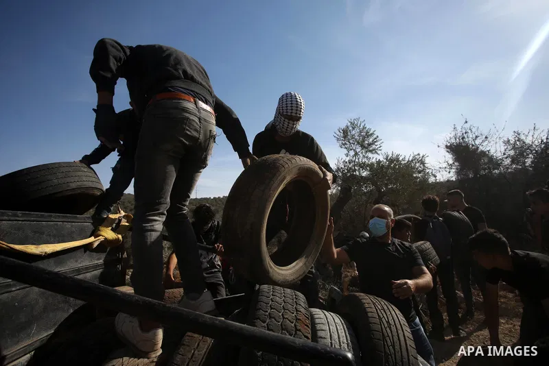 Palestinian protesters clash with Israeli forces during a demonstration against settlements in the village of Beita in the West Bank, on November 12, 2021. Photo by Shadi Jarar'ah