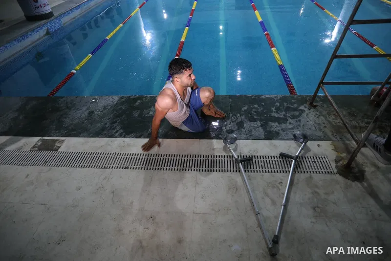 Palestinian amputees take part in a swimming championship at al-Sadaka Club in Gaza City November 14, 2021. Almost 50,000 Palestinians are classified as "disabled" among the 2-million population of the blockaded Gaza Str...