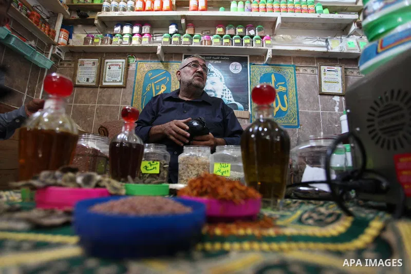 A Palestinian specialist in alternative medicine, Jamal Inaya, 60, displays the natural herbs at a small clinic in his home in Khan Yunis in the southern Gaza Strip, on November 14, 2021. Traditional Palestinian Medicine...