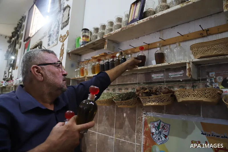 A Palestinian specialist in alternative medicine, Jamal Inaya, 60, displays the natural herbs at a small clinic in his home in Khan Yunis in the southern Gaza Strip, on November 14, 2021. Traditional Palestinian Medicine...