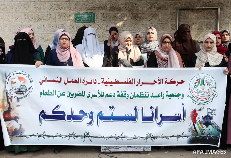 Palestinian supporters of the Al-ahrar Movement take part in a protest in solidarity with prisoners on hunger strike at Israeli jails, in front of Red Cross office in Gaza city on November 15, 2021. Five Palestinian pris...