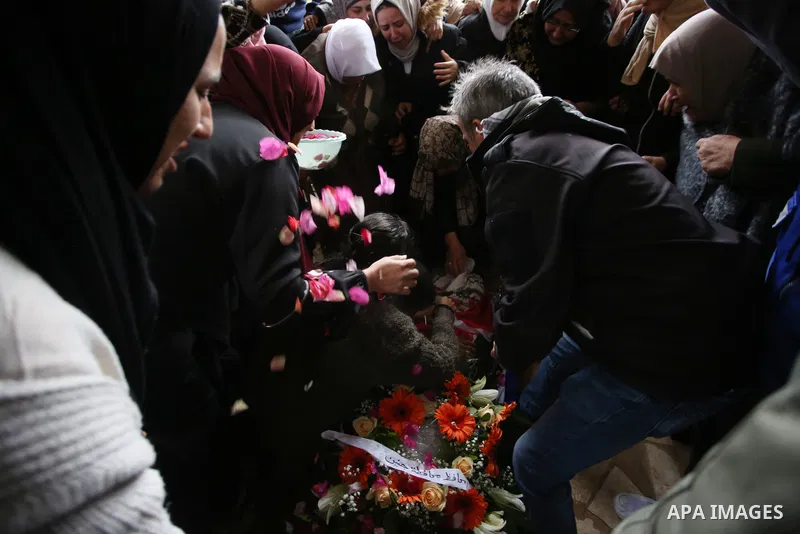 Palestinians carry the body of Isra Ekhzemiya during her funeral at Qabatya village near the West Bank City of Jenin, 20 November 2021. According to medical sources, Isra was killed on 30 September by Israeli soldiers af...