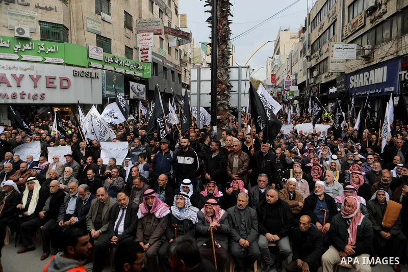 Palestinian supporters of Hizb ut-Tahrir or the Islamic Liberation Party of the Islamic Liberation Party take part in a protest against recent family quarrels in the West Bank town of Hebron, on November 20, 2021. Hebron...
