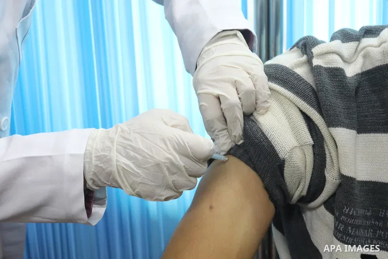 Palestinians get inoculated with a dose of the Covishield vaccine against the Covid-19 coronavirus, at a temporary vaccination centre set up, in Deir al-Balah in the center of Gaza Strip on November 211, 2021. Minister o...