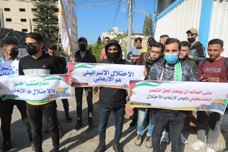 Palestinian students take part in a protest against the British Home Secretary Priti Patel decision to ban Hamas in front of the UNESCO headquarters, in Gaza city on November 22, 2021. Hamas has condemned a move by Brita...