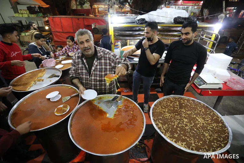 Masoud Al-Qatati, a Palestinian man sells sweets low prices and sometimes free for customers due to the difficult economic conditions of the residents of the Gaza Strip, in Gaza city on November 23, 2021. Al-Qatati said...