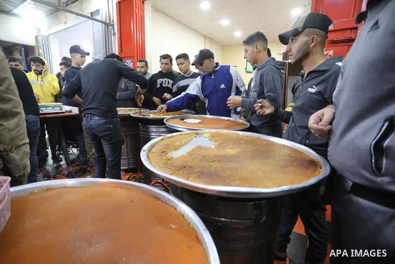 Masoud Al-Qatati, a Palestinian man sells sweets low prices and sometimes free for customers due to the difficult economic conditions of the residents of the Gaza Strip, in Gaza city on November 23, 2021. Al-Qatati said...