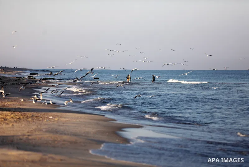 Palestinian fishermen work on the shore of the Mediterranean Sea, in Gaza city, on November 27, 2021. The Israeli authorities released the two detained fishermen at Erez crossing, north of Gaza, and seized their boat. Is...