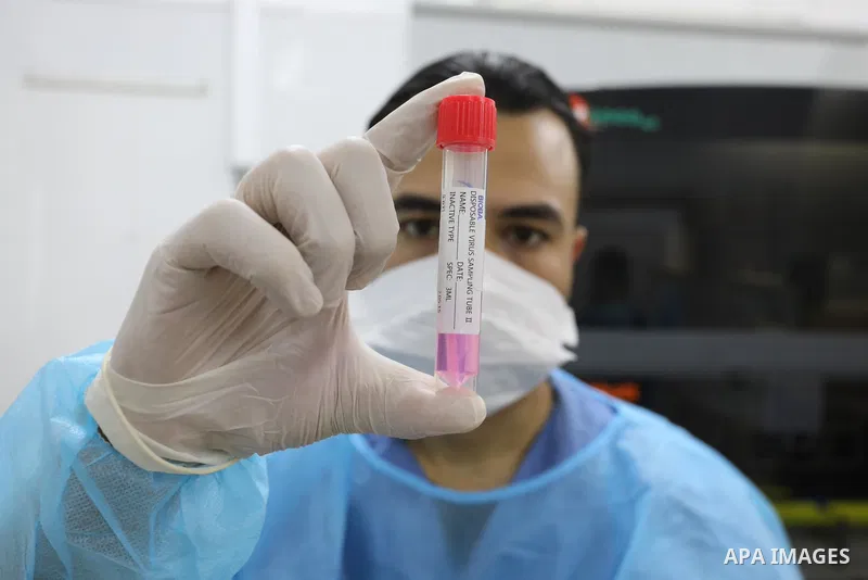 Palestinian Laboratory Medicine Specialist, tests vials of samples for coronavirus at Medical Laboratory, in Gaza city on November 28, 2021. In the past week a heavily mutated Covid variant has been identified, rapidly l...