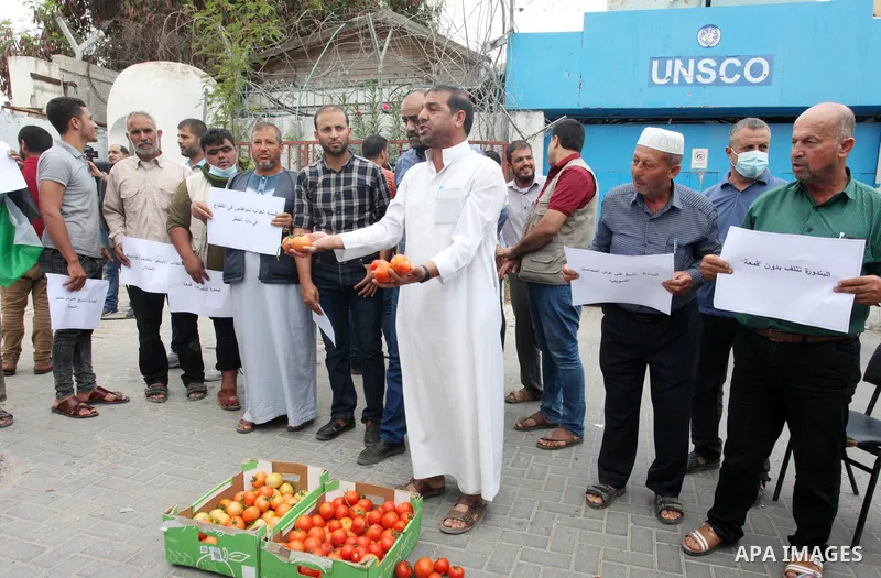 Palestinian farmers and traders take part in a protest against Israeli authorities a new restriction on them in front of the headquarter United Nation "UNSCO", in Gaza city, on October 3, 2021. Israeli authorities have p...