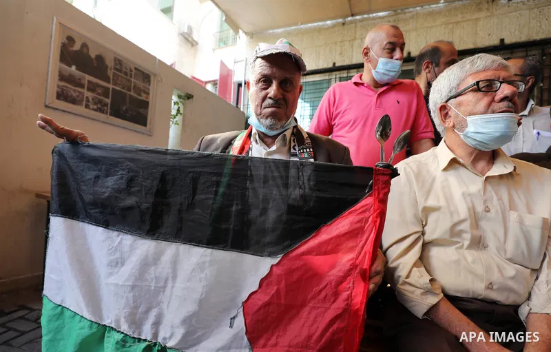 Palestinians take part in a protest to show solidarity with prisoners, in Israeli Jails in front of Red Cross headquarters, on October 4, 2021. Hundreds of Palestinian political detainees in Israeli prisons are expected...