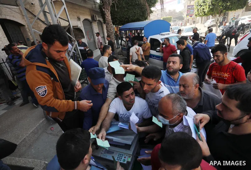 Palestinian citizens waiting in front of the Gaza Chamber of Commerce and Industry ​headquarters to register in order to work inside the Israel territories, in Jabalia, northern Gaza Strip, on October, 06 2021. The Gaza...
