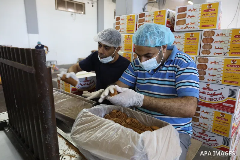 Palestinian workers prepare the vanilla candy known as "Ras El-abed or Shatawi" in the sweet factory , in Deir al-Balah, central Gaza Strip on October 7, 2021. “Ras el Abed” means “Head of Slave”. We would often laugh ab...