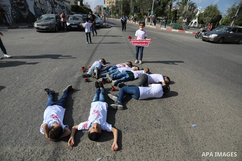 Palestinian children tak epart in a scene entitled "Enough Accidents" in Gaza City on October 09, 2021. Dealing with traffic accident cases and their repercussions does not fall under the Traffic Law only, but also under...