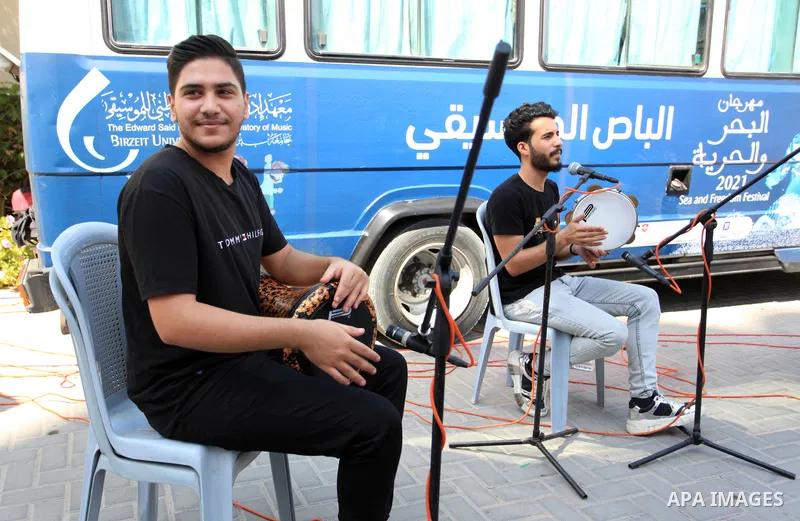 Palestinian members of musical band from "Edward Said National Conservatory of Music" perform in a festival of "Sea and Freedom" at Al-Amal Institute for Orphans, in Gaza city on October 9, 2021. The Gaza Strip has been...