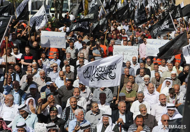 Palestinian supporters of Hizb ut-Tahrir or the Islamic Liberation Party of the Islamic Liberation Party march demanding a ban on Jewish prayer at Al-Aqsa mosque in the West Bank town of Hebron, on October 09, 2021. An I...