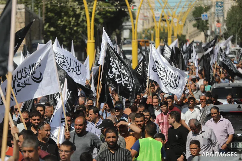 Palestinian supporters of Hizb ut-Tahrir or the Islamic Liberation Party of the Islamic Liberation Party march demanding a ban on Jewish prayer at Al-Aqsa mosque in the West Bank town of Hebron, on October 09, 2021. An I...