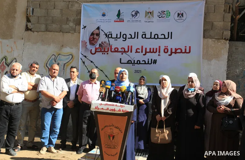Palestinians take part in a protest to show solidarity with prisoner Israa Al-Jaabis helds in Israeli Jails, in Gaza city on October 10, 2021. Israa Jaabis, a 36-year-old Palestinian mother from Jerusalem who has been la...