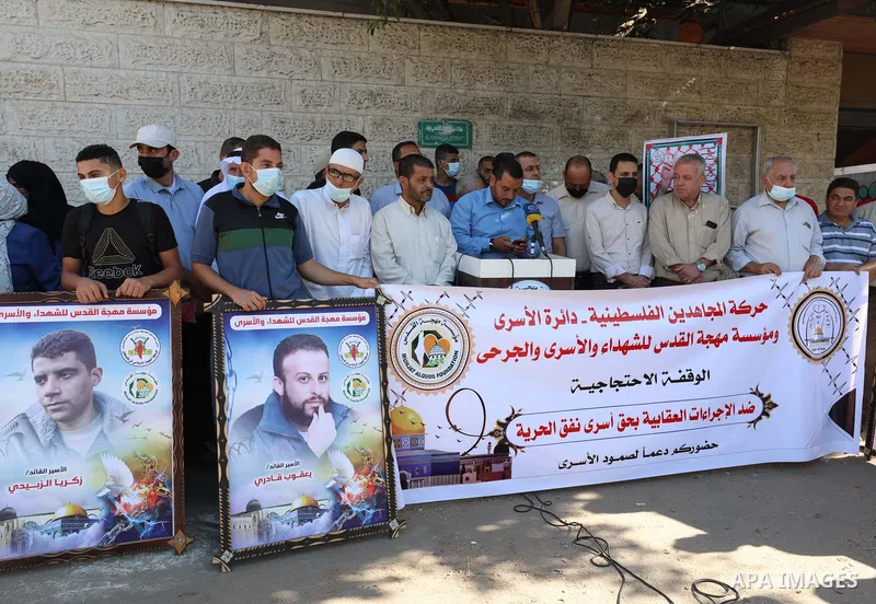 Palestinians take part in a protest to show solidarity with prisoners, in Israeli Jails in front of Red Cross headquarters in Gaza city, on October 11, 2021. Hundreds of Palestinian political detainees in Israeli prisons...