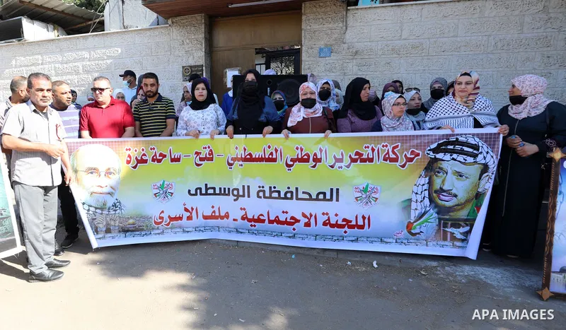 Palestinians take part in a protest to show solidarity with prisoners, in Israeli Jails in front of Red Cross headquarters in Gaza city, on October 11, 2021. Hundreds of Palestinian political detainees in Israeli prisons...