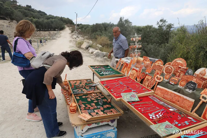 Palestinians visit the Roman basilica and forum in the village of Sebastia near the West Bank city of Nablus, on October 11, 2021.The ancient town of Sebastia is one of the greatest archaeological sites of the Holy Land,...