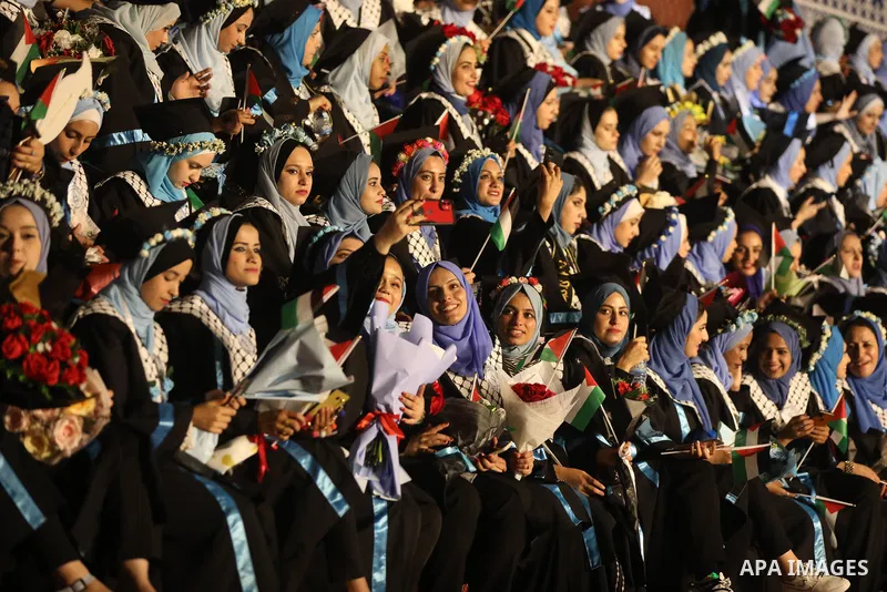 Palestinian students from al-Azhar University attend their graduation ceremony, in Gaza city on October 12, 2021. Photo by Ashraf Amra