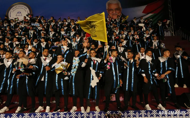 Palestinian students from al-Azhar University attend their graduation ceremony, in Gaza city on October 12, 2021. Photo by Ashraf Amra