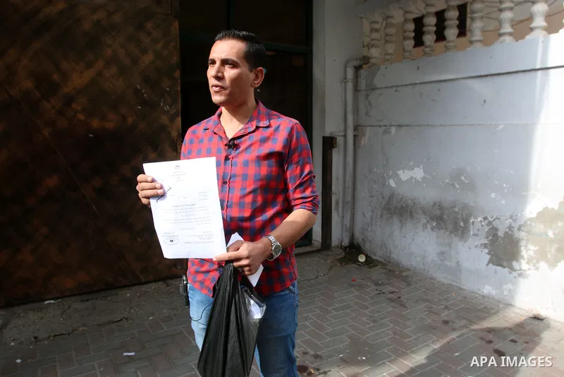 Palestinians wait to legalize their documents at Civil Affairs office, in Gaza city on October 12, 2021. Israel on Monday approved 442 reunification requests submitted by Palestinian families in the West Bank and Gaza, a...