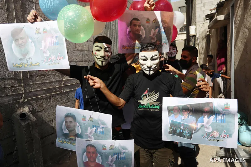 Palestinians take part in a rally ​on 10th anniversary of prisoners swap deal between Hamas and Israel, in Jabalia in the northern Gaza strip on October 15, 2021. October will mark a decade since the last major swap deal...