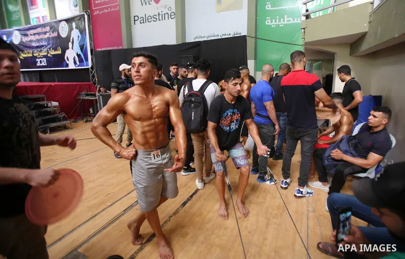 Palestinian bodybuilders take part in Physique and Bodybuilding competition organized by the Palestinian union of Bodybuilding and Fitness, in Gaza city on October 15, 2021. Photo by Ashraf Amra