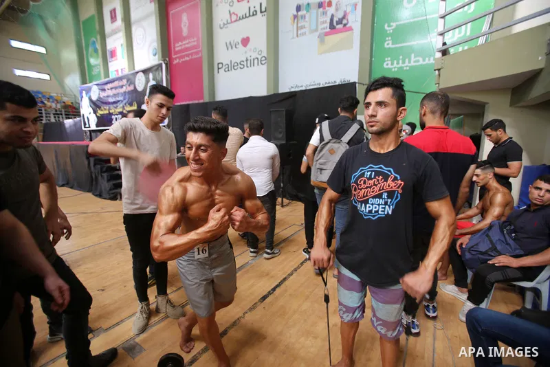Palestinian bodybuilders take part in Physique and Bodybuilding competition organized by the Palestinian union of Bodybuilding and Fitness, in Gaza city on October 15, 2021. Photo by Ashraf Amra