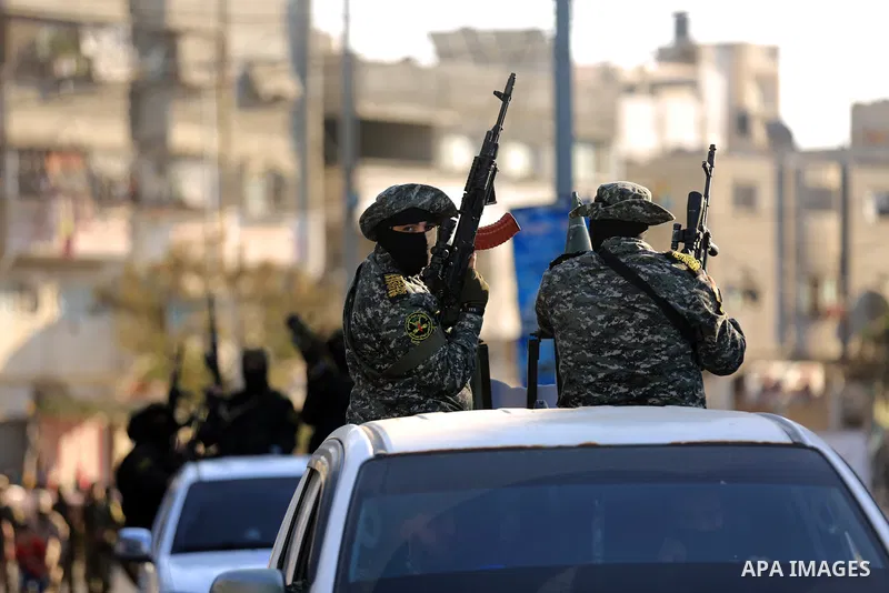 Palestinian militants from the Al-Quds Brigades, the armed wing of the Islamic Jihad movement, take part in a military parade, in support of prisoners on hunger strike held in Israeli jails in Gaza city on October 15, 20...