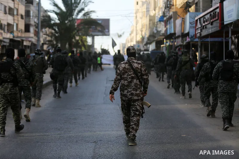 Palestinian militants from the Al-Quds Brigades, the armed wing of the Islamic Jihad movement, take part in a military parade, in support of prisoners on hunger strike held in Israeli jails in Gaza city on October 15, 20...