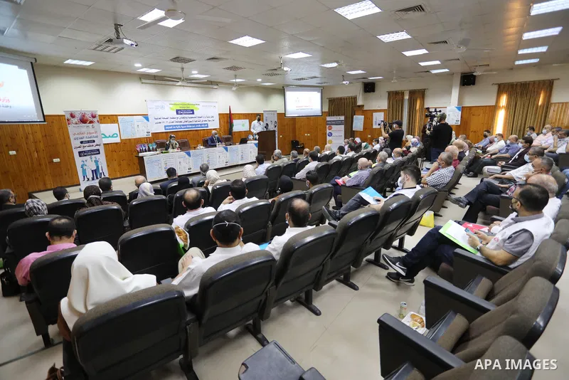 Palestinians attend a scientific conference on the occasion of International Infection Prevention Week inside Shifa Hospital, in Gaza city on October 17, 2021. International Infection Prevention Week (IIPW), established...