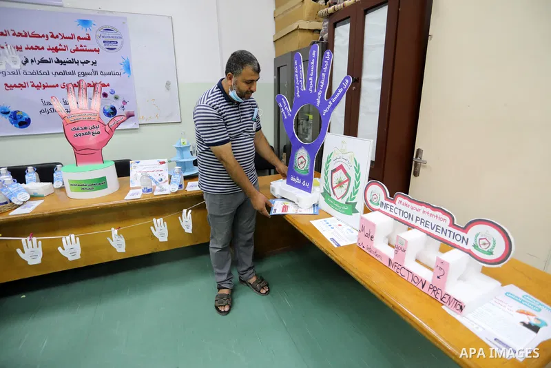 Palestinians attend a scientific conference on the occasion of International Infection Prevention Week inside Shifa Hospital, in Gaza city on October 17, 2021. International Infection Prevention Week (IIPW), established...