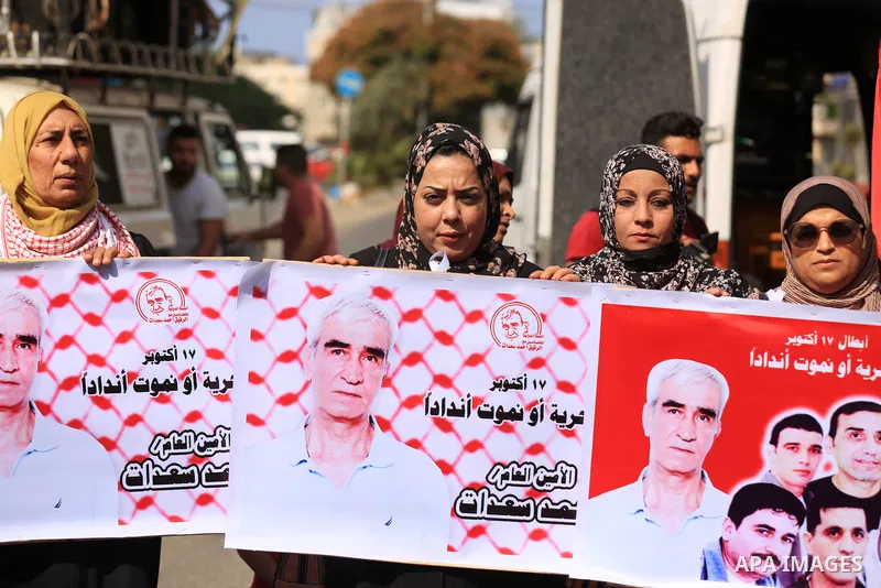 Palestinian supporters of the Popular Front for the Liberation of Palestine take part in a protest on the anniversary of the17th of October, in front of Red cross office in Gaza, on October 17, 2021. Photo by Ashraf Amra