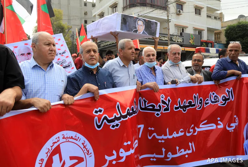 Palestinian supporters of the Popular Front for the Liberation of Palestine take part in a protest on the anniversary of the17th of October, in front of Red cross office in Gaza, on October 17, 2021. Photo by Ashraf Amra