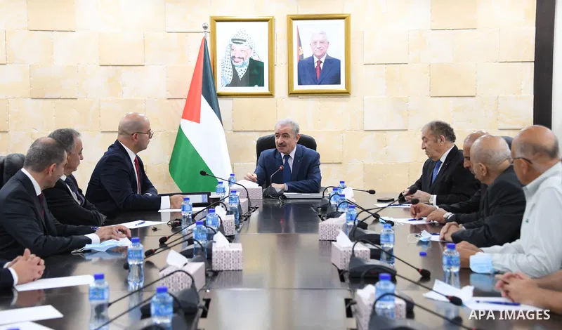 Palestinian Prime Minister Mohammed Ishtayeh meets with Chairman and members of the chamber of commerce and industry in Jerusalem, at his office in the West Bank city of Ramallah, on October 17, 2021. Photo by Prime Mini...