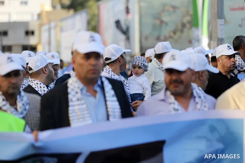 Palestinians take part in a march marking the 10th anniversary of prisoners swap deal between Hamas and Israel, in Gaza city on October 18, 2021. October will mark a decade since the last major swap deal between Israel a...