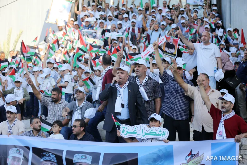 Palestinians take part in a march marking the 10th anniversary of prisoners swap deal between Hamas and Israel, in Gaza city on October 18, 2021. October will mark a decade since the last major swap deal between Israel a...