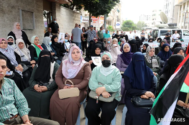 Palestinians take part in a rally ​on 10th anniversary of prisoners swap deal between Hamas and Israel, in front of Red cross office, in Gaza city on October 18, 2021. October will mark a decade since the last major swap...