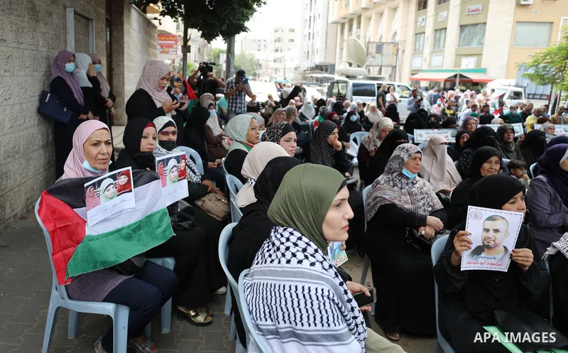 Palestinians take part in a rally ​on 10th anniversary of prisoners swap deal between Hamas and Israel, in front of Red cross office, in Gaza city on October 18, 2021. October will mark a decade since the last major swap...