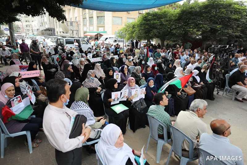 Palestinians take part in a rally ​on 10th anniversary of prisoners swap deal between Hamas and Israel, in front of Red cross office, in Gaza city on October 18, 2021. October will mark a decade since the last major swap...