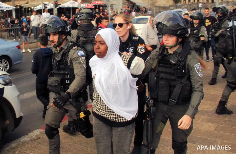 Israeli forces detain a Palestinian protester during clashes near Damascus Gate just outside Jerusalem's Old City, on October 18, 2021. Photo by Mahfouz Abu Turk
