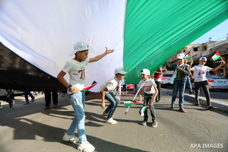 Palestinians take part in a march marking the 10th anniversary of prisoners swap deal between Hamas and Israel, in Gaza city on October 18, 2021. October will mark a decade since the last major swap deal between Israel a...