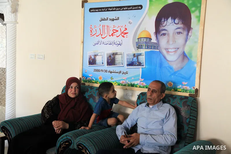The family of Palestinian Mohammad Al-Durrah who was killed by Israeli forces sit at their home, in the Al-Bureij refugee camp in the central Gaza Strip, on October 19, 2021. On 30 September 2000, Al-Durrah and his fathe...