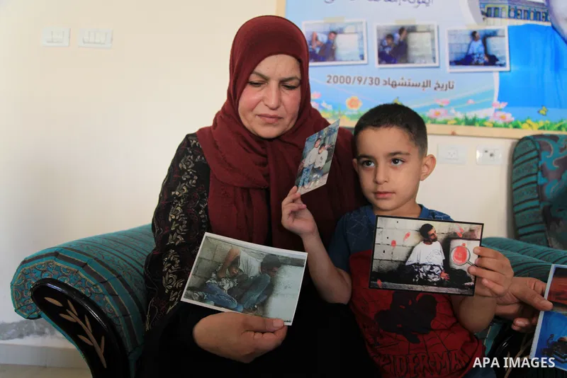 The family of Palestinian Mohammad Al-Durrah who was killed by Israeli forces sit at their home, in the Al-Bureij refugee camp in the central Gaza Strip, on October 19, 2021. On 30 September 2000, Al-Durrah and his fathe...