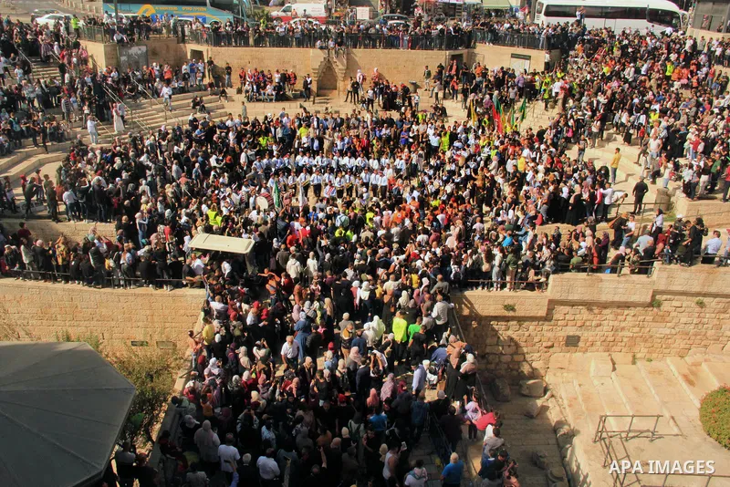 Palestinian Muslims attend a scouts rally during a festival of Eid-e-Milad-ul-Nabi, the birth anniversary of the Prophet Mohammad, near Damascus Gate just outside Jerusalem's Old City, on October 19, 2021. Photo by Mahfo...