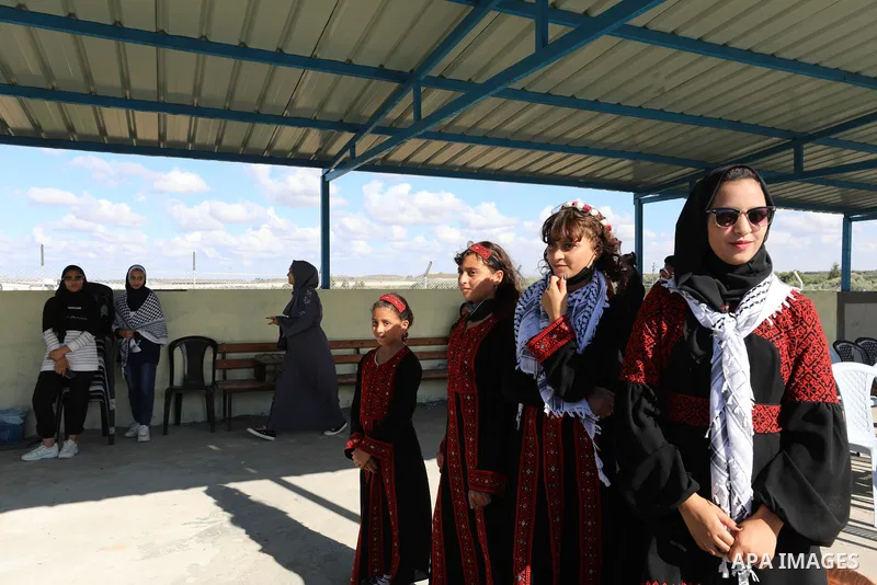 The family of Palestinian female prisoner Nesreen Abu Kamil wait her to enter Gaza Erez crossing in Beit Hanoun in the northern Gaza Strip after she released from Israeli jails on October 19, 2021. The Palestinian prison...